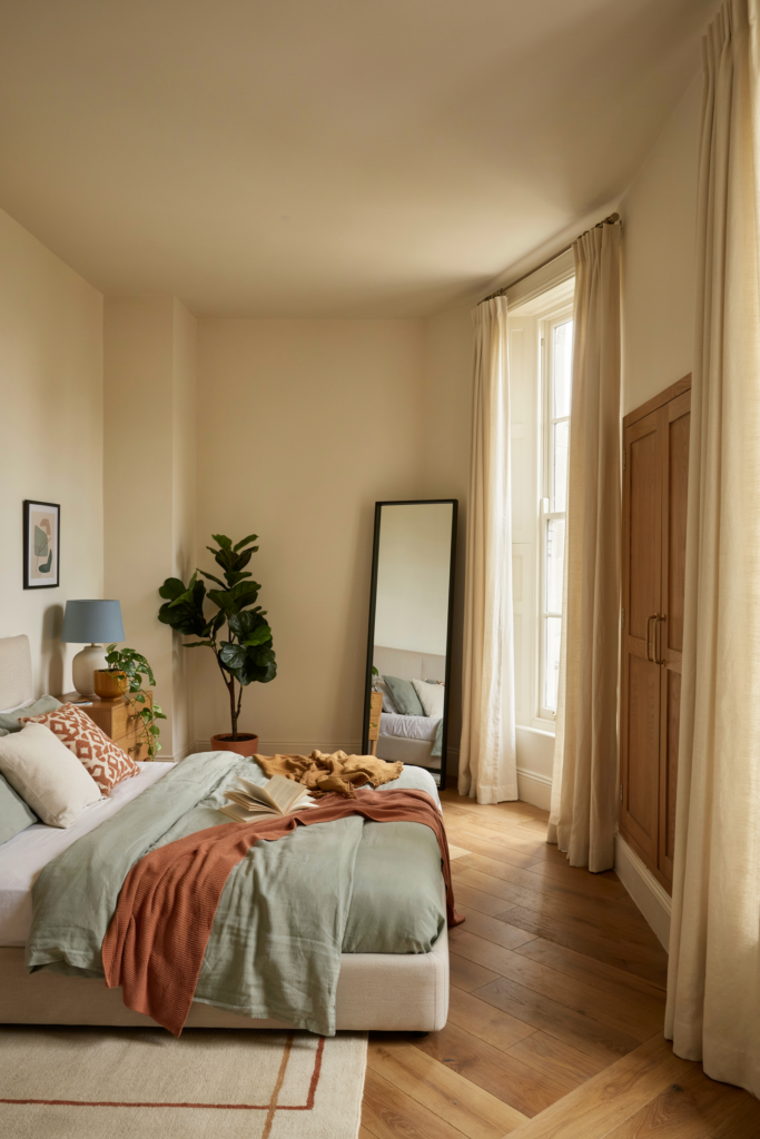 2. Standing mirror in a bedroom corner